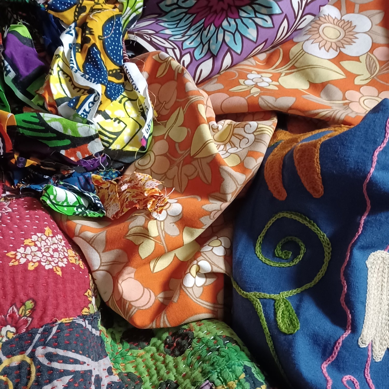 diferent types of fabrics, vintage, african wax and indian kantha throw